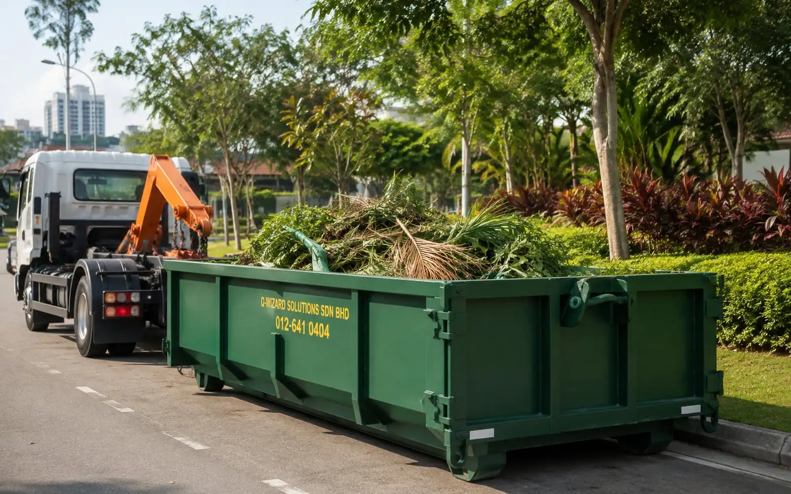Illustration of a green RORO bin loaded with tropical branches beside a landscaped Malaysian verge.